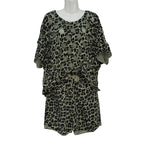 Camiseta Lacandona oversize mangas murciélago animal print círculos calados