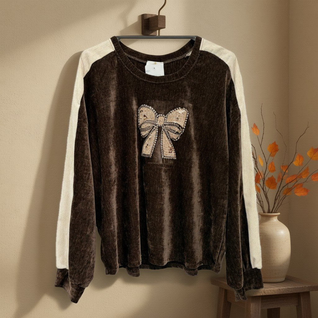 Sudadera granada colgada en un ambiente para mujer Angara Moda