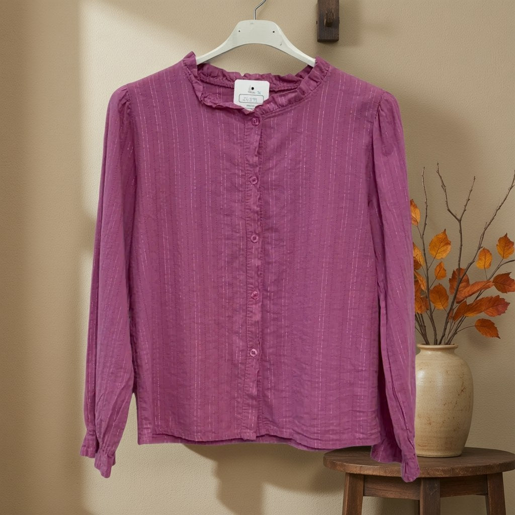Camisa lluvia colgada en un ambiente para mujer Angara Moda