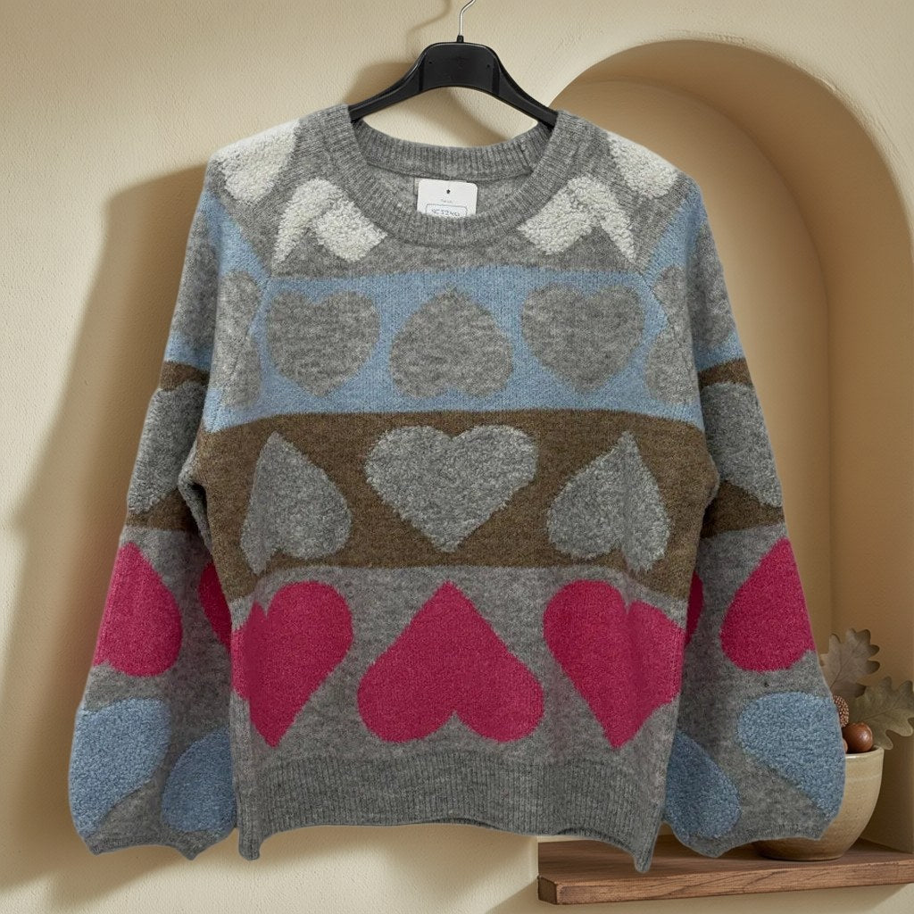 Jersey purpel colgada en un ambiente para mujer Angara Moda