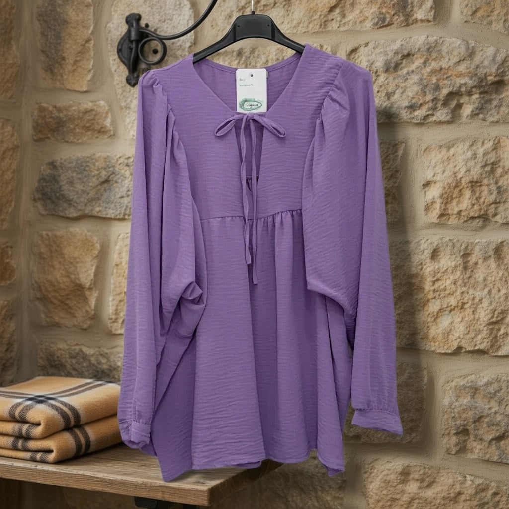Blusa susana colgada en un ambiente para mujer Angara Moda