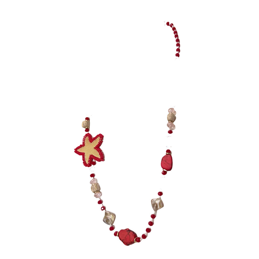 Collar Selena Largo Cristales Estrella de Mar Bordada Artesanal sobre fondo blanco, vista lateral para mujer Angara Moda
