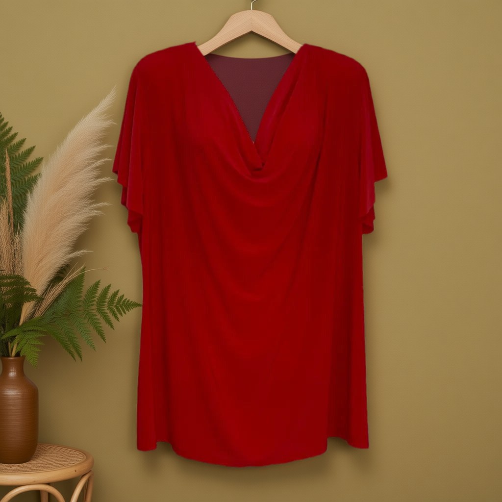 Blusa Candela con Escote Drapeado y Manga Mariposa colgada en un ambiente para mujer Angara Moda