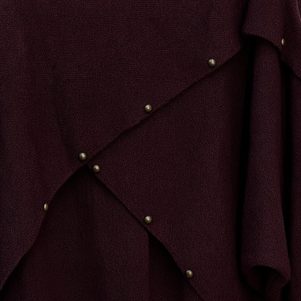 Detalle del tejido de Jersey Rebeca de punto con diseño asimétrico para mujer Angara Moda