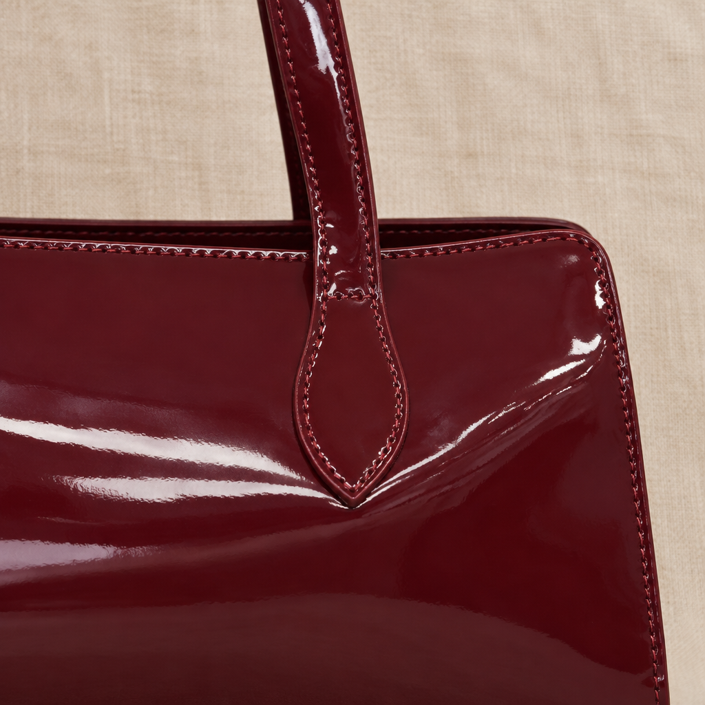 Bolso Garza burdeos detalle del asa y acabado brillante para mujer Angara Moda